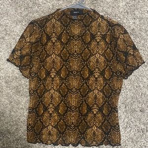 Mesh mock neck reptile print top with lettuce edge hem
